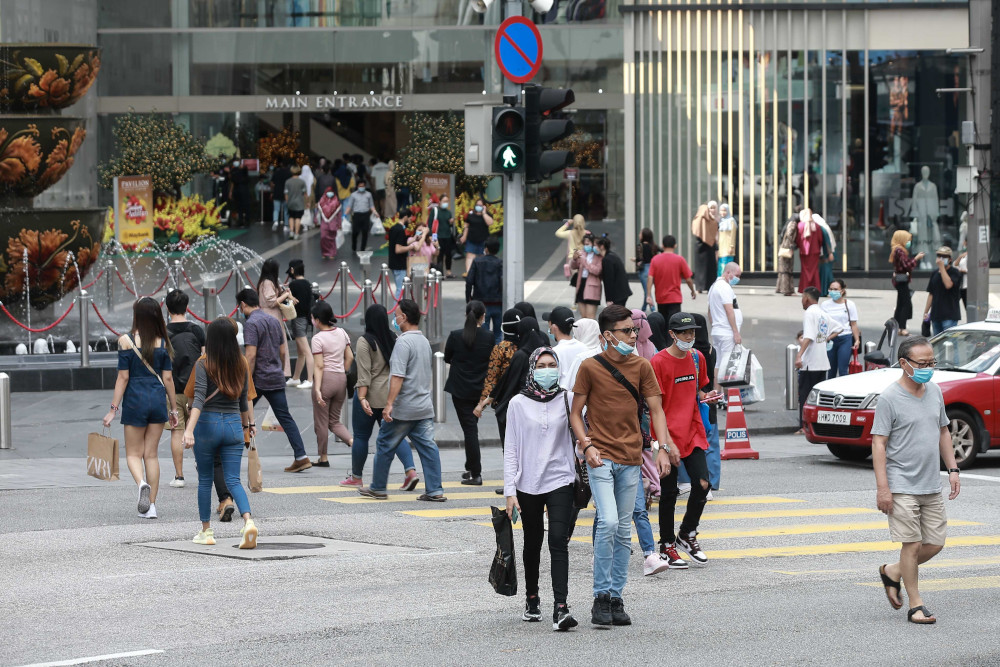 Shoppers are seen near the Pavilion shopping mall on the third day of Hari Raya Aidilfitri May 26, 2020. u00e2u20acu201d Picture by Ahmad Zamzahuri