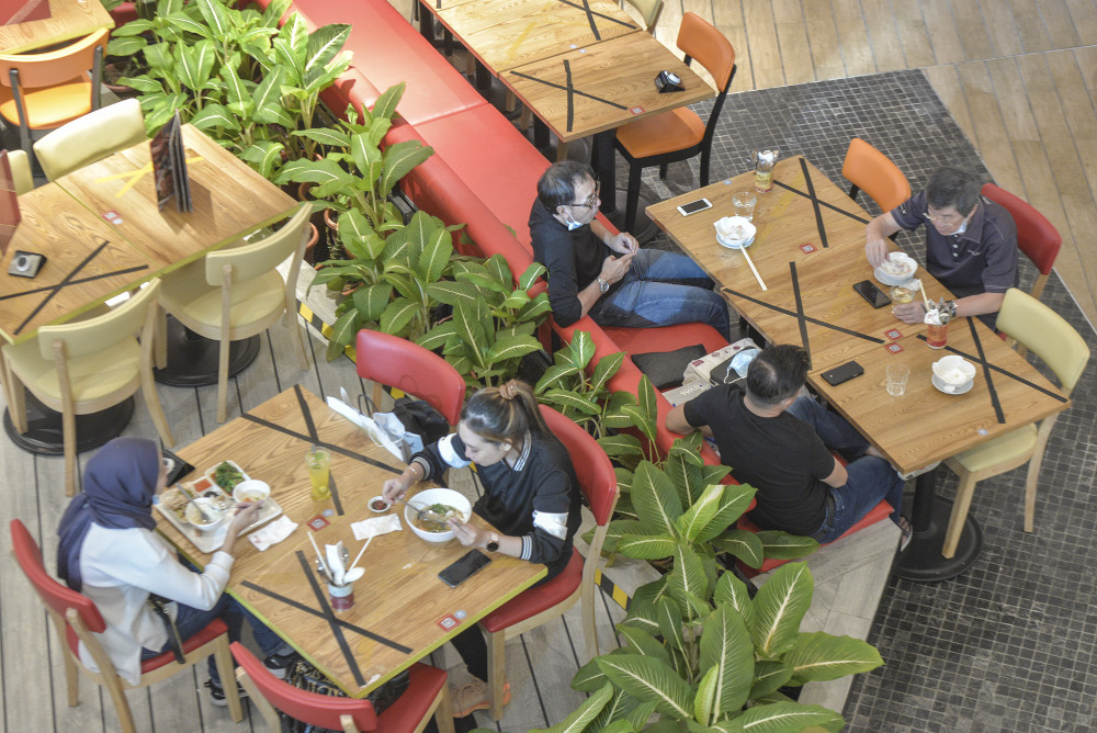 People are seen dining in as they practise social distancing at one of the shopping malls in Kuala Lumpur, May 26, 2020 u00e2u20acu201d Picture by Shafwan Zaidon