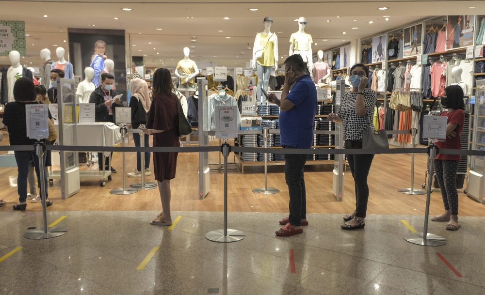 Shoppers line up at one of the stores at one of the shopping malls in Kuala Lumpur, May 26, 2020 u00e2u20acu201d Picture by Shafwan Zaidon