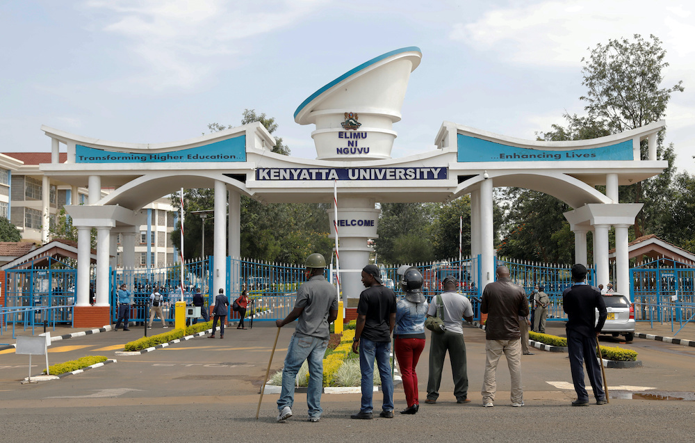 Kenyan police officers stand in front of a gate where quarantined travellers protest being held because of the Covid-19 outbreak for more than the usual 14 days at Kenyatta University near Nairobi, Kenya, April 15, 2020. u00e2u20acu201d Reuters pic