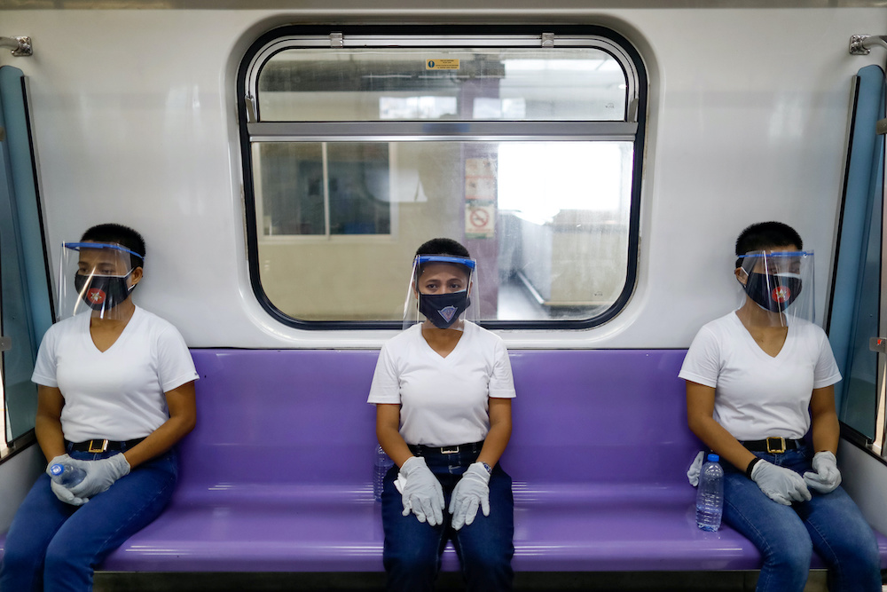 Police trainees wearing personal protective equipment maintain social distancing in a train during a simulation exercise amid the coronavirus disease (Covid-19) outbreak, in Manila May 26, 2020. u00e2u20acu201d Reuters pic