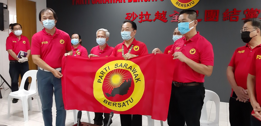 PSB president Datuk Sri Wong Soon Koh (middle) handing over the party flag to Selangau Member of Parliament Baru Bian, May 30, 2020. u00e2u20acu201d Picture by Sulok Tawie
