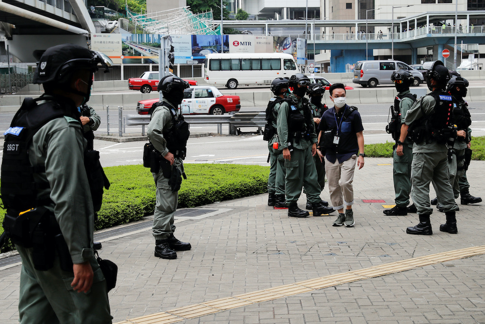 Riot police officers stand guard outside Central Government Complex as a second reading of a controversial national anthem law takes place in Hong Kong, China May 27, 2020. u00e2u20acu201d Reuters pic