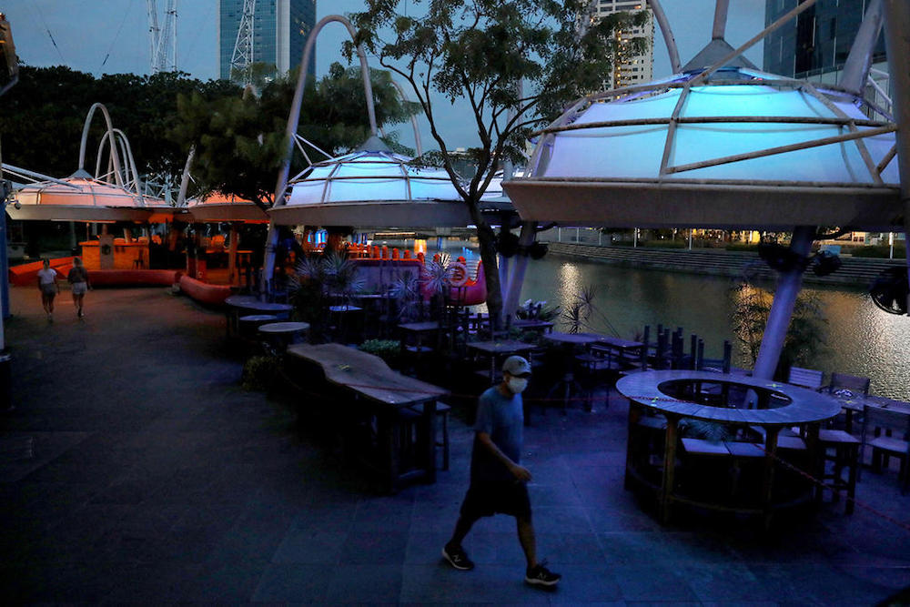 The lights were switched off at closed businesses along Clarke Quay during the circuit breaker on May 27, 2020. u00e2u20acu201d TODAY pic