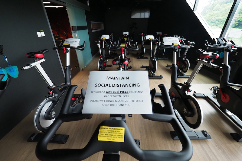 Signs placed over gym equipment at TFX gym at Funan, April 27, 2020. — TODAY pic