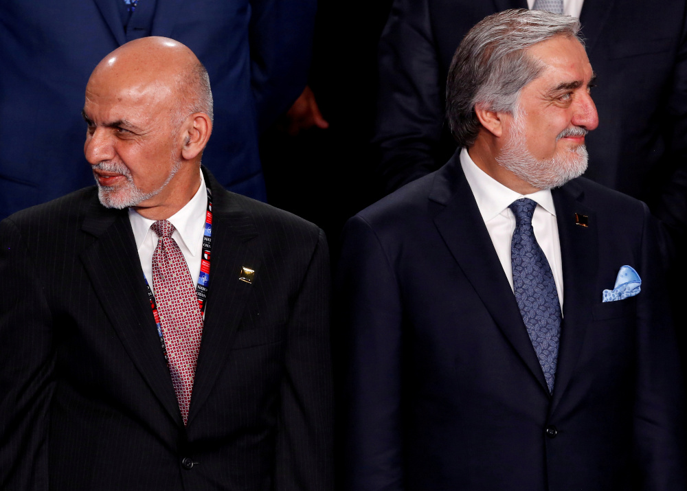Afghanistanu00e2u20acu2122s President Ashraf Ghani (left) and Afghanistanu00e2u20acu2122s Chief Executive Abdullah Abdullah participate in a family photo at the Nato Summit in Warsaw, Poland July 8, 2016. u00e2u20acu201d Reuters pic 
