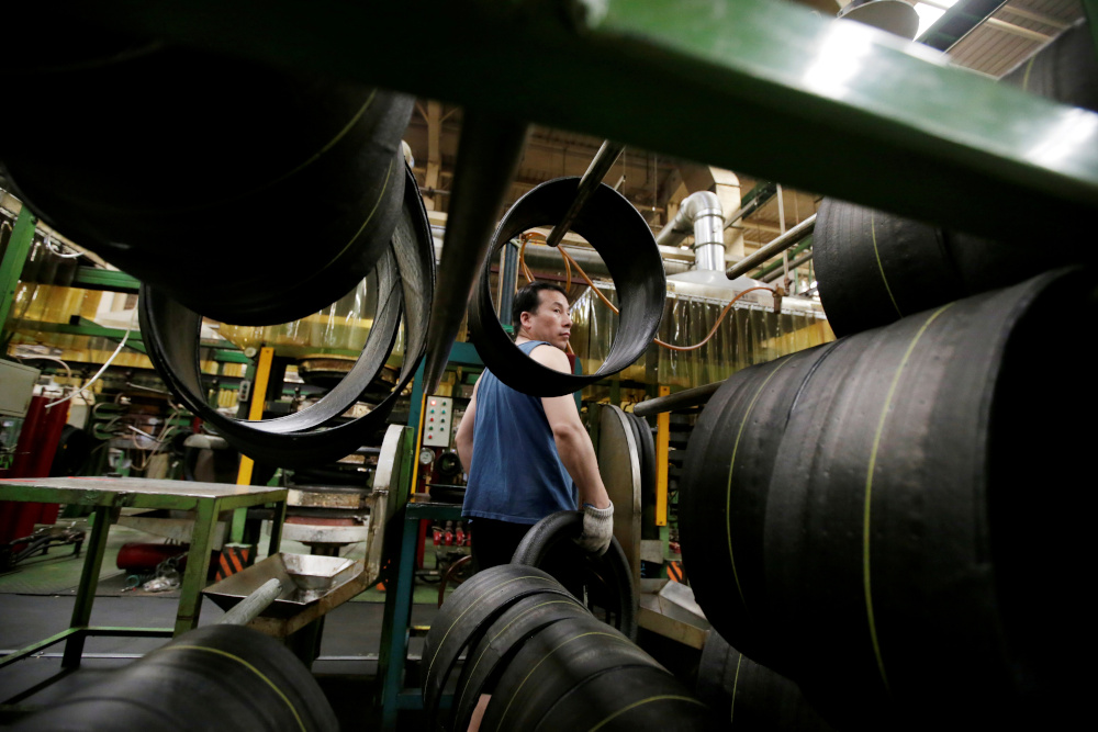 An employee works on the production line of a tyre factory under Tianjin Wanda Tyre Group, which exports its products to countries such as US and Japan, in Xingtai, Hebei province, China May 21, 2019. u00e2u20acu201d Reuters pic 