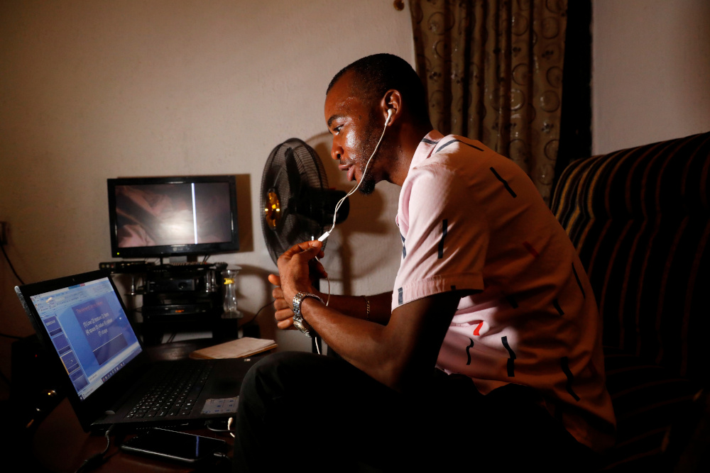 Nigerian teacher, Emmanuel Ntaji, speaks to his students during an e-learning class via Zoom app, at his home, during a lockdown in Lagos, Nigeria April 23, 2020. — Reuters pic 