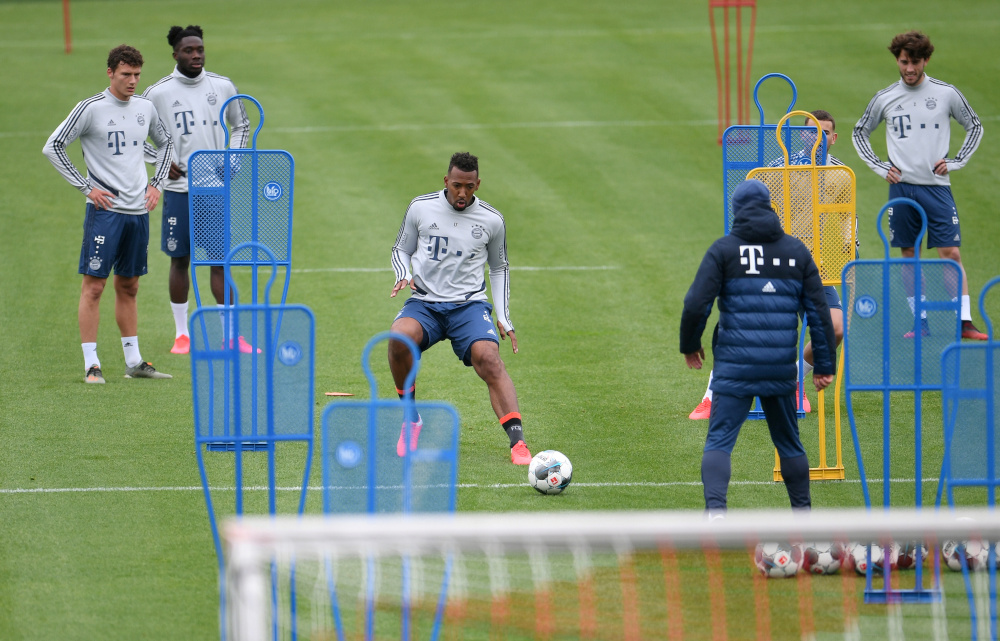 Bayern Munich coach Hans-Dieter Flick with Jerome Boateng as players look on during training in Munich, Germany May 5, 2020, despite most sport being cancelled around the world as the spread of coronavirus disease continues. u00e2u20acu201d Reuters pic 