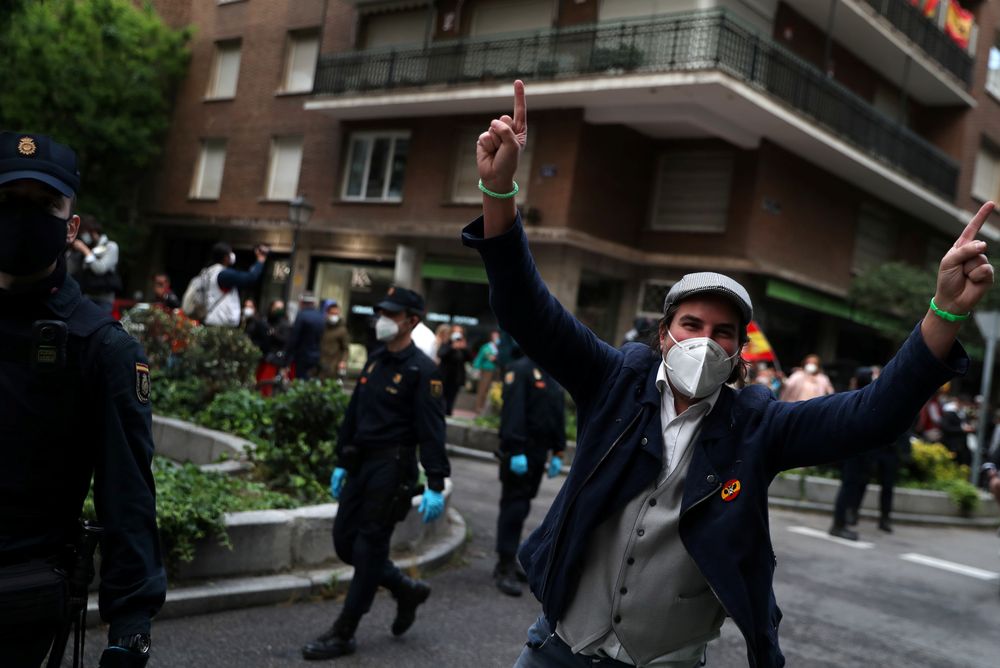 A demonstrator wearing a protective face mask takes part in a protest against the Spanish governmentu00e2u20acu2122s handling of the coronavirus disease (Covid-19) crisis, in Madrid, Spain, May 15, 2020. u00e2u20acu201d Reuters pic