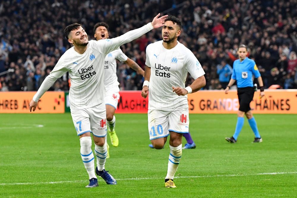 Marseilleu00e2u20acu2122s midfielder Dimitri Payet (right) is congratulated by Nemanja Radonjic after scoring a goal during the French L1 match Olympique de Marseille vs Toulouse FC at the Velodrome Stadium in Marseille, France, February 08, 2020. u00e2u20acu201d AFP pic