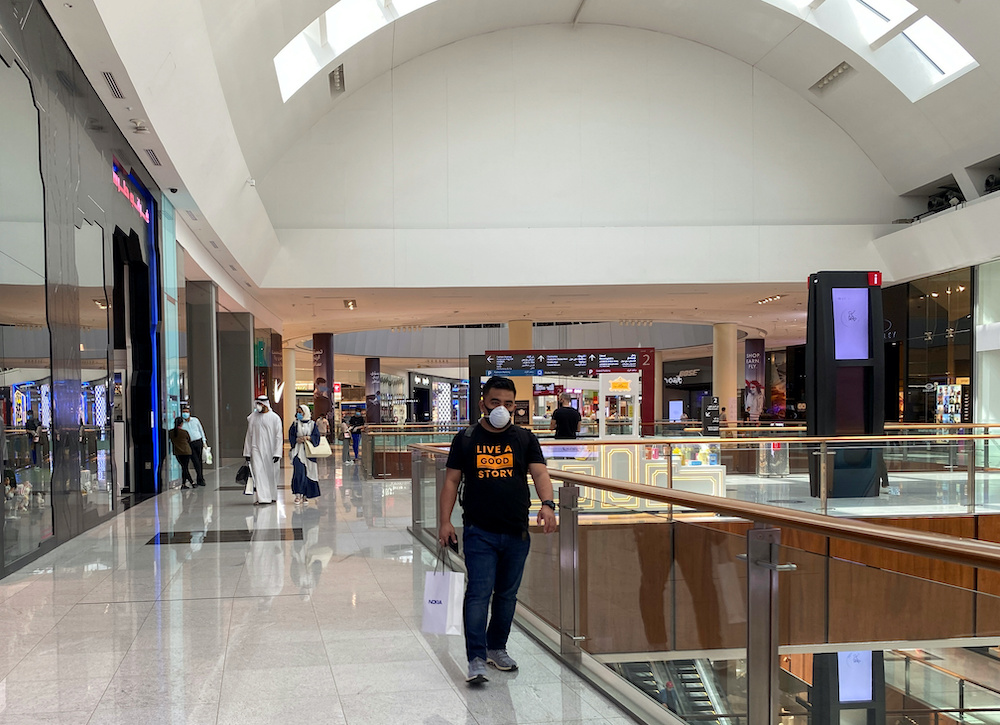 People wearing protective face masks shop at Dubai mall after the UAE government eased a curfew and allowed stores to open, following the outbreak of the coronavirus disease in Dubai, United Arab Emirates May 3, 2020. u00e2u20acu201d Reuters picnn