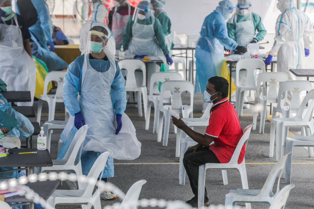 Health workers conduct Covid-19 screening in Petaling Jaya Old Town May 11, 2020. u00e2u20acu201d Picture by Firdaus Latif