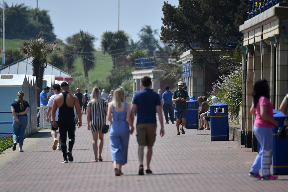 People walk along the promenade in Eastbourne, southern England May 9, 2020, as life in Britain continues over the May bank holiday weekend, during the nationwide lockdown due to the novel coronavirus Covid-19 pandemic. u00e2u20acu201d AFP pic 