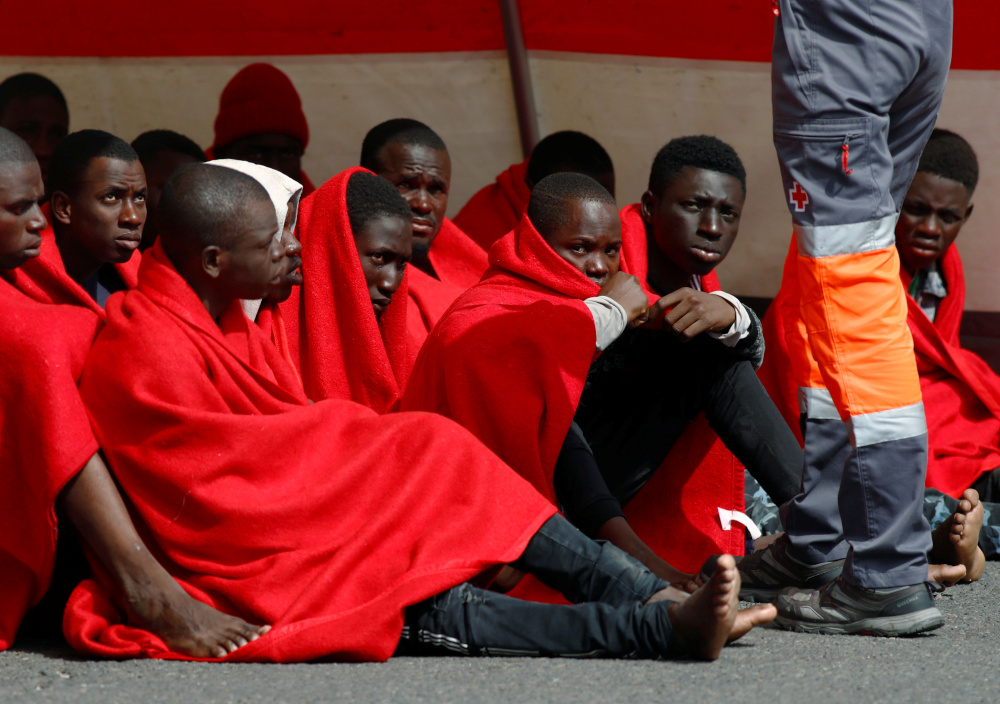 Migrants rescued in the Atlantic Ocean disembark from a Spanish coast guard vessel in the port of Arguineguin on the island of Gran Canaria, Spain, May 17, 2020. u00e2u20acu201d Reuters picnn