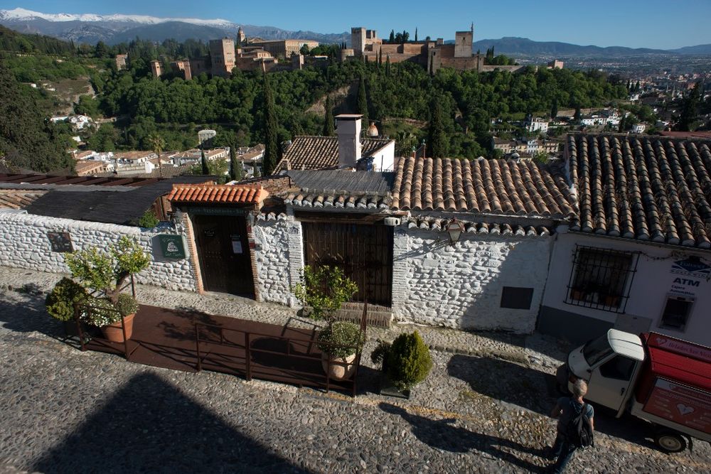 A man walks in a street in Granada on May 2, 2020. All Spaniards are again allowed to leave their homes since today to walk or play sports after 48 days of very strict confinement to curb the coronavirus pandemic. u00e2u20acu201d AFP pic