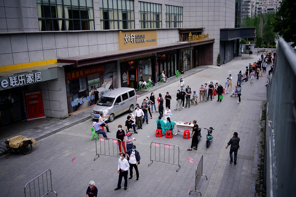 Residents wearing face masks queue for nucleic acid testings in Wuhan, the Chinese city hit hardest by the coronavirus disease outbreak, Hubei province, China May 16, 2020. u00e2u20acu2022 Reuters pic