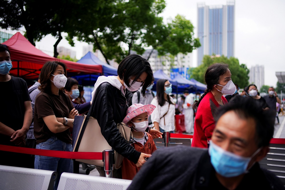 Residents wearing face masks queue for nucleic acid testings in Wuhan, the Chinese city hit hardest by the coronavirus disease outbreak, Hubei province, China May 16, 2020. u00e2u20acu2022 Reuters pic 