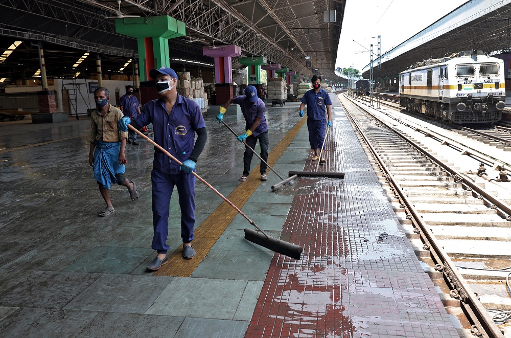 Workers clean a platform at the Howrah Junction railway station after India announced a limited re-opening of its giant rail network beginning today, on the outskirts of Kolkata May 11, 2020. u00e2u20acu2022 Reuters pic