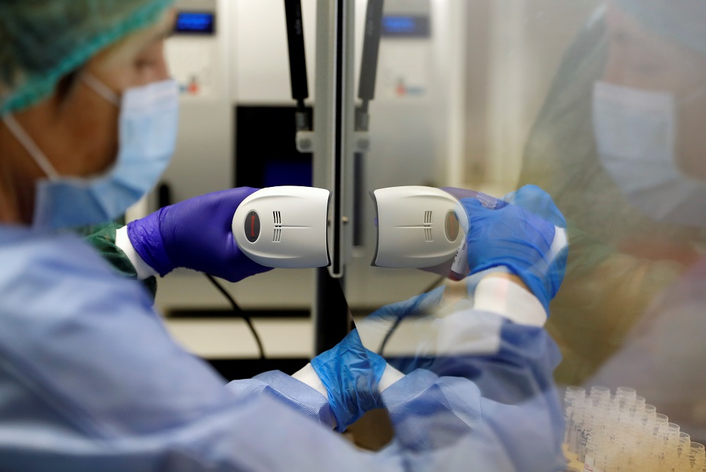Medical workers analyse a test vial at a laboratory of the San Filippo Neri hospital, to check for the coronavirus disease in Rome May 7, 2020. u00e2u20acu2022 Reuters pic