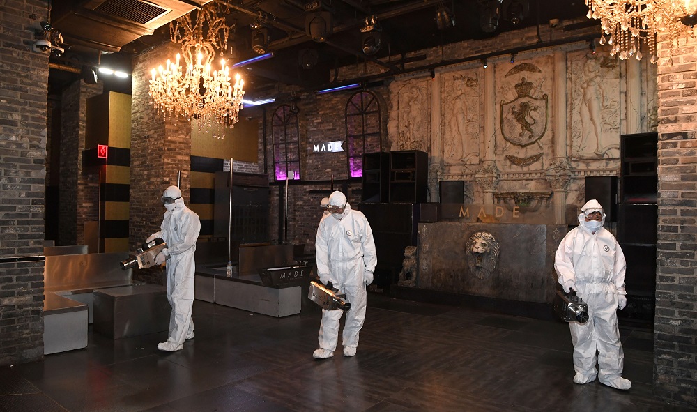 Quarantine worker spray disinfectants at a night club on the night spots in the Itaewon neighbourhood, following the Covid-19 outbreak, in Seoul May 12, 2020. u00e2u20acu2022 Handout via Reuters