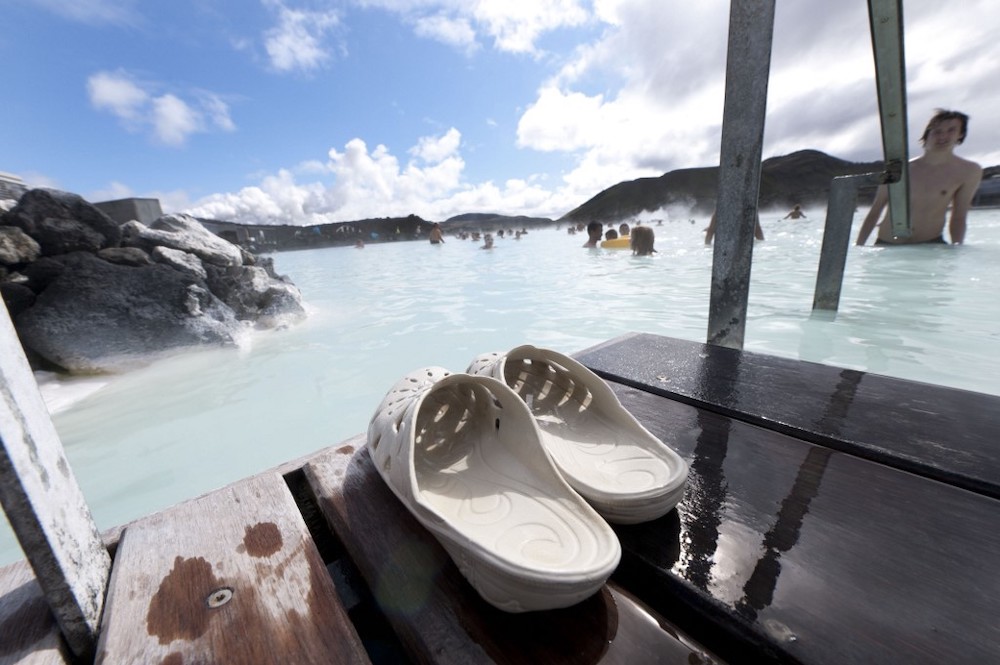 In this file photo taken on August 04, 2010 shows a tourist at Blue Lagoon in Svartsendi, Iceland which is next to the Svartsengi Power Station, near Grindavik. — AFP pic