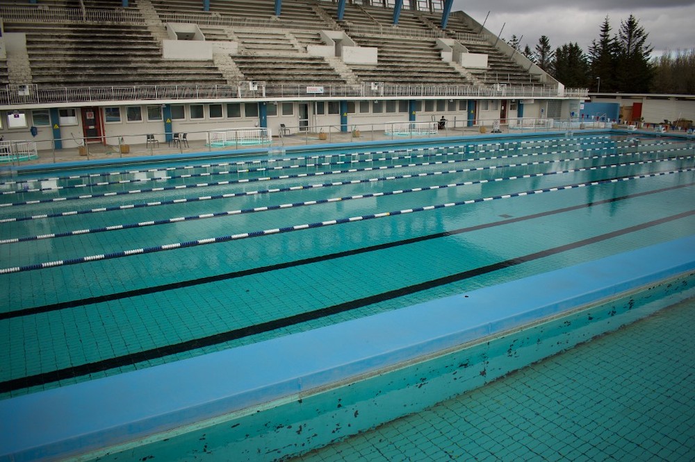 This picture taken on April 27, 2020 shows a view of the 50m outdoor pool at the biggest swimming pool of Iceland, Laugardalslaug, closed du to the novel Coronavirus pandemic in Reykjavik, Iceland. u00e2u20acu201d AFP picnnn
