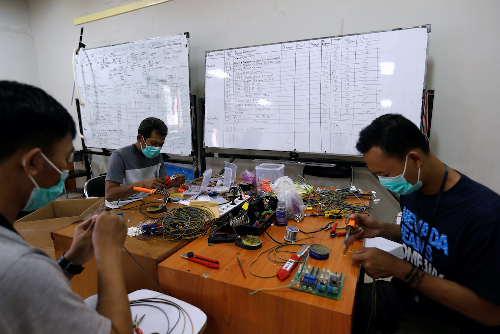 Volunteers prepare parts of u00e2u20acu02dcVent-Iu00e2u20acu2122, an innovation ventilator for coronavirus disease patients, at their workshop in Bandung, West Java province, Indonesia, May 5, 2020. Picture taken May 5, 2020. u00e2u20acu201d Reuters picnn