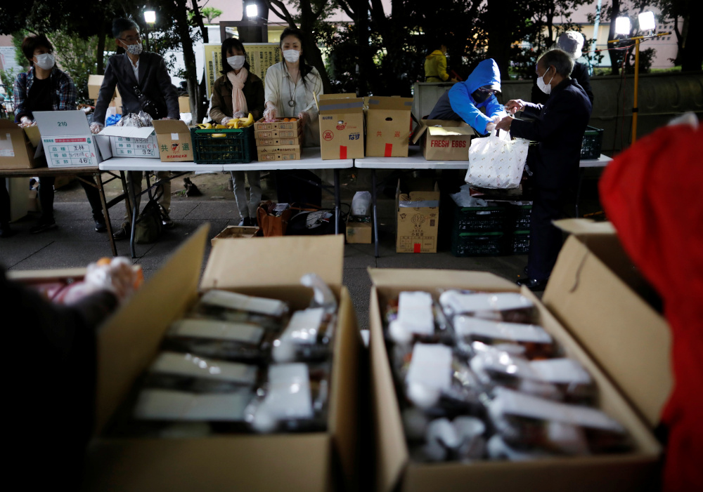 Volunteers take part in food aid handouts for the needy, as the spread of the coronavirus disease continues in Tokyo, Japan, May 9, 2020. u00e2u20acu201d Reuters pic 