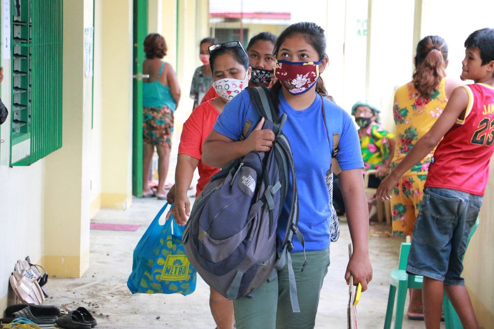 Residents wearing masks for protection against coronavirus disease arrive at a school turned evacuation centre as they prepare for Typhoon Vongfong in Legazpi City, Albay province, Philippines, May 14, 2020. u00e2u20acu201d Reuters pic