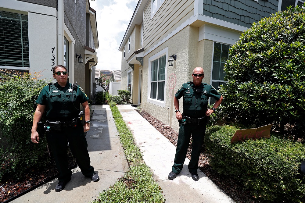 Police officers stand outside the Florida home of former Minneapolis police officer Derek Chauvin in the Windermere neighbourhood of Orlando May 29, 2020. u00e2u20acu2022 Reuters pic