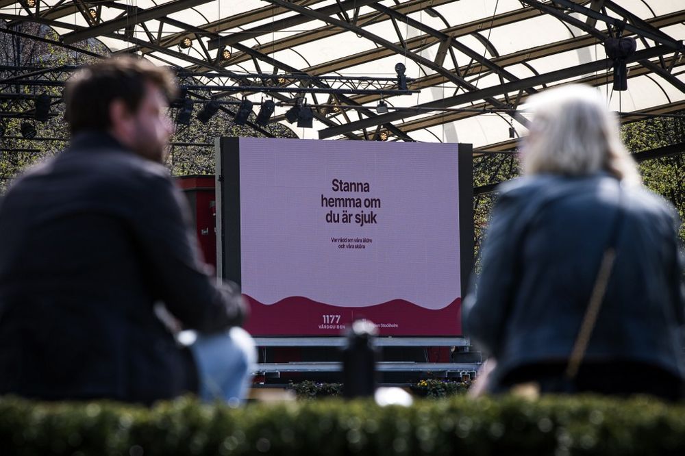 An advertisement of the Swedish healthcare services instructs people to stay home if they are sick, on May 8, 2020 in Stockholm, Sweden, amid the new coronavirus Covid-19 pandemic. u00e2u20acu201d AFP pic