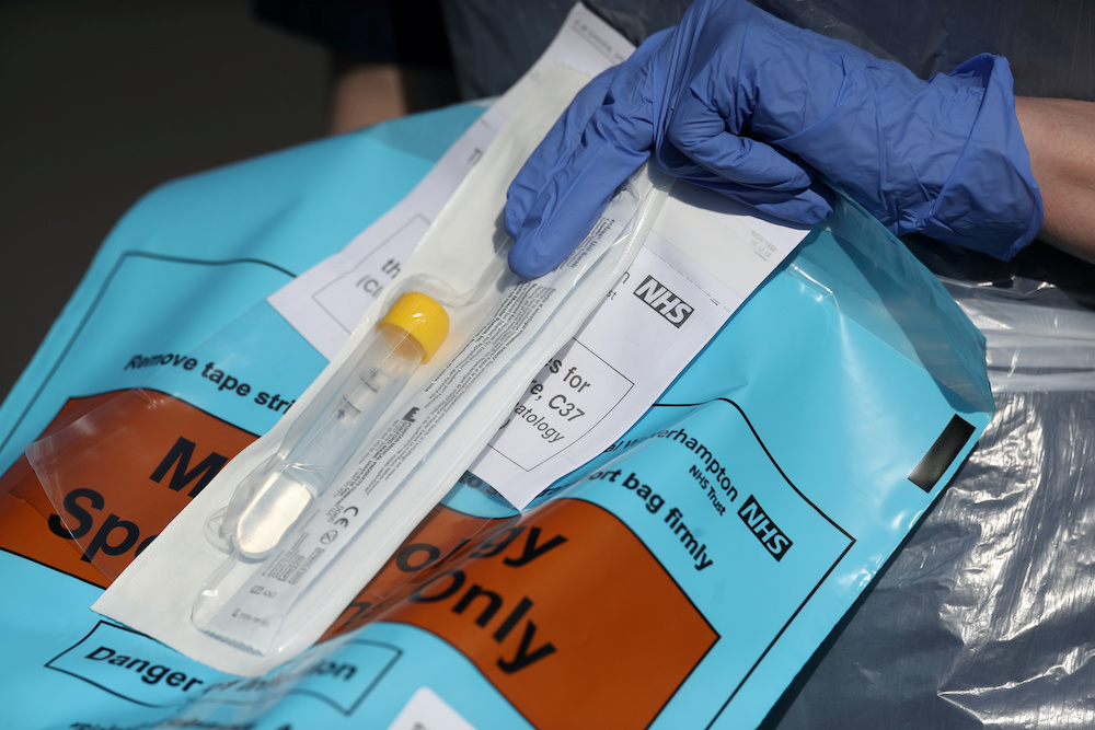 A member of medical staff is seen holding a testing kit at an NHS coronavirus disease testing facility, as the spread of the coronavirus disease continues, Wolverhampton, Britain, April 7, 2020. u00e2u20acu201d Reuters picnn