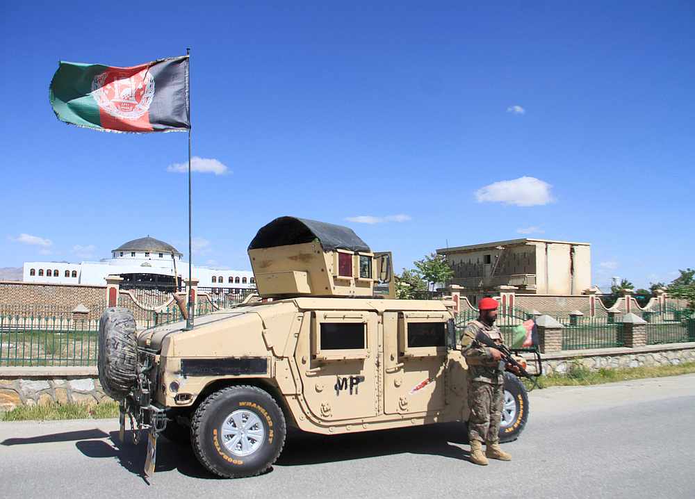 An Afghan National Army officer stands guard at the site of a blast in Ghazni province, Afghanistan May 18, 2020. u00e2u20acu201d Reuters pic