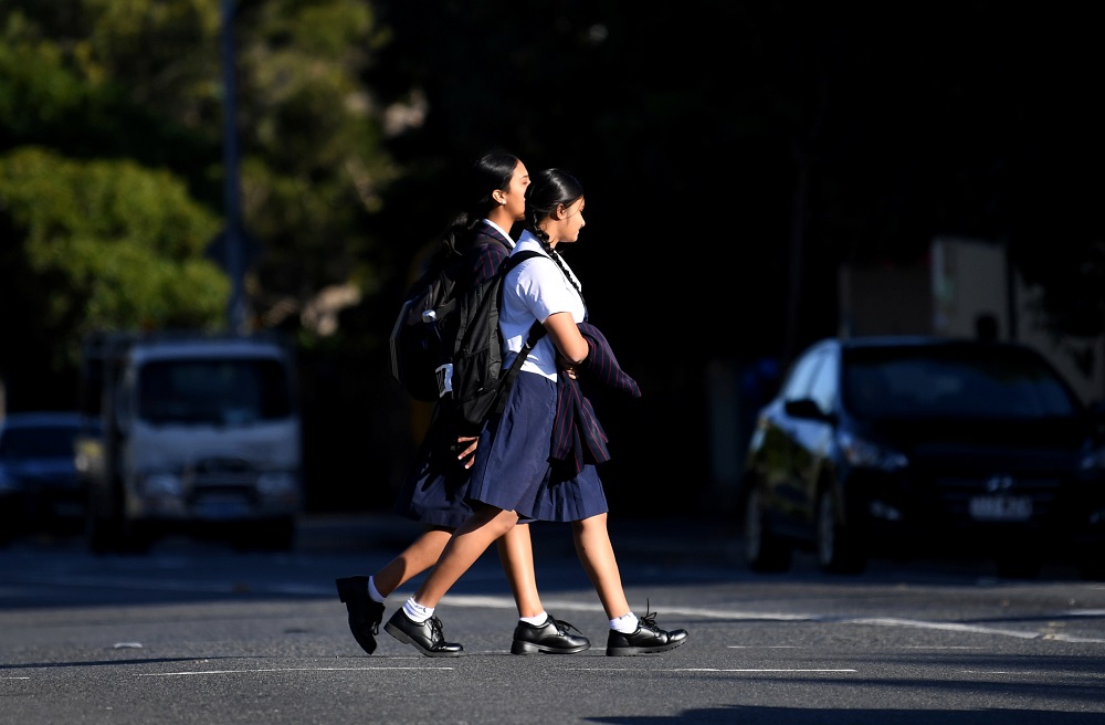 Students arrive for the first day of face-to-face schooling after a period of learning from home due to coronavirus disease precautions in Brisbane May 11, 2020. u00e2u20acu2022 Handout via Reuters