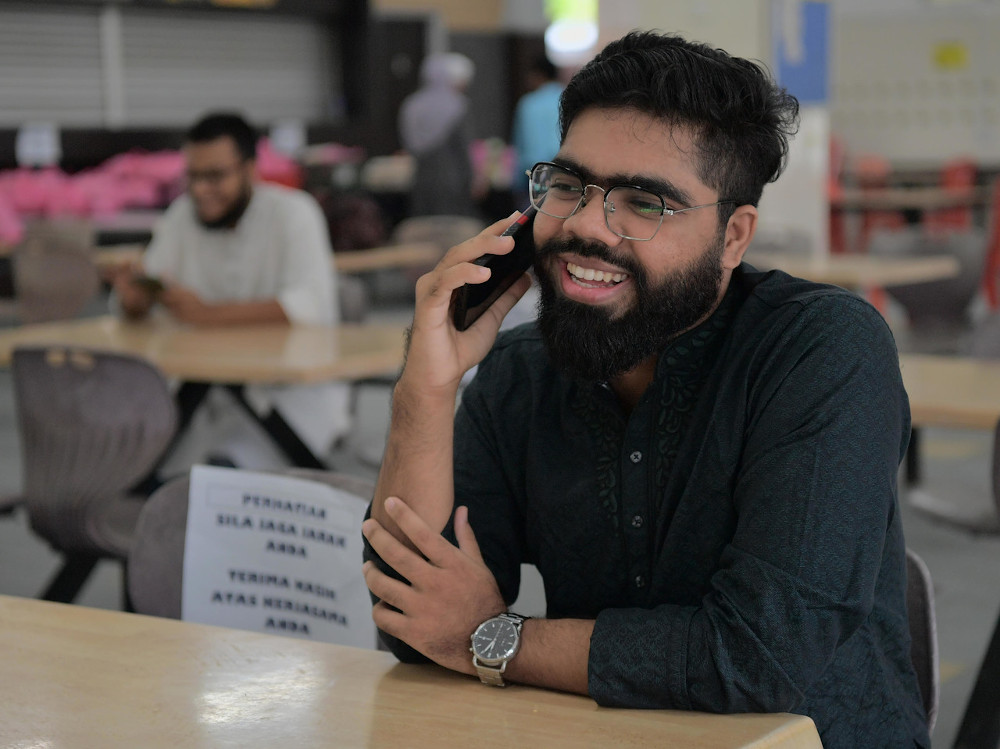 UTM Skudai student Sayem Rahman, 24, speaks on the phone as he celebrates Hari Raya Aidilfitri on campus in Johor Baru due to the Covid-19 outbreak May 24, 2020. u00e2u20acu201d Bernama pic