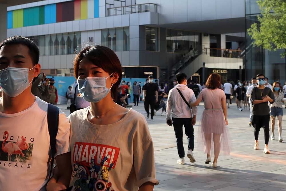 People wearing face masks following the Covid-19 outbreak walk at a shopping complex in Beijing, China May 24, 2020. u00e2u20acu201d Reuters pic