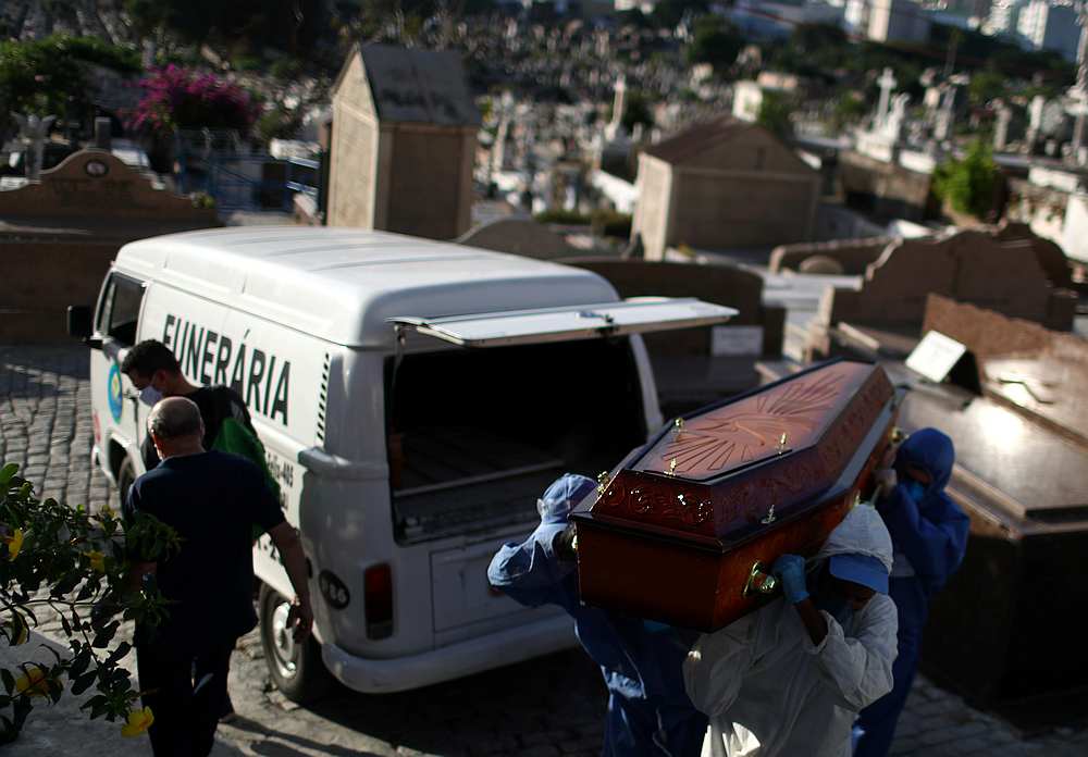 Gravediggers wearing protective suits carry the coffin of Andre Wendel, who died from Covid-19 at the Sao Joao Batista cemetery in Rio de Janeiro, Brazil May 28, 2020. u00e2u20acu201d Reuters pic