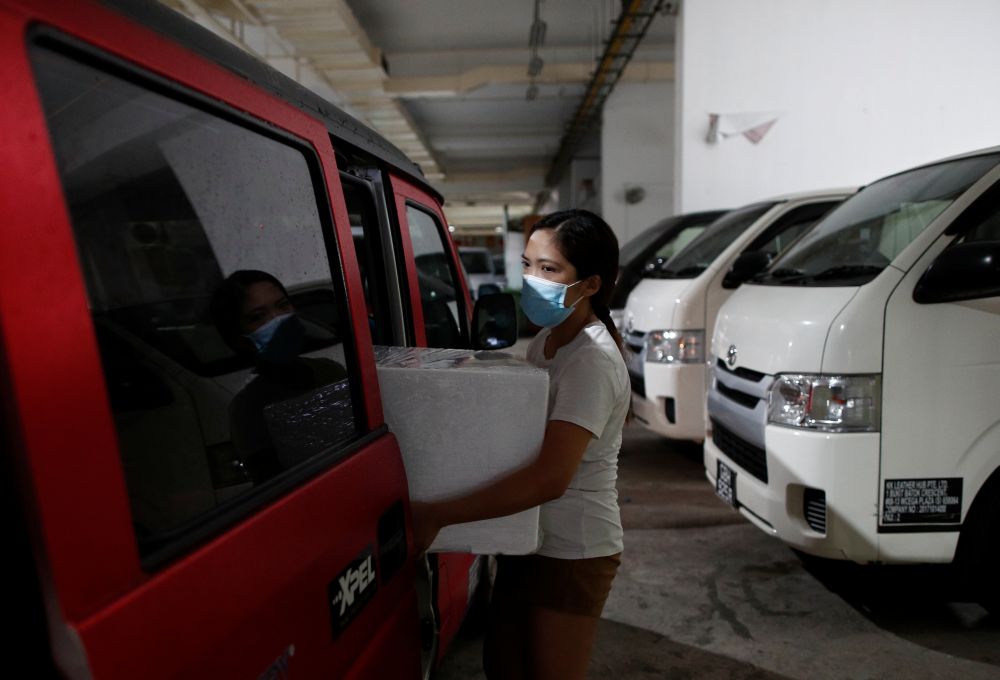A Malaysian mother who is residing in Singapore brings her frozen breastmilk to be delivered back to the country for her child in Singapore May 11, 2020. u00e2u20acu201d Reuters pic