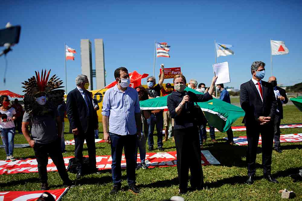 Members of the congress show the request of impeachment against Brazil's President Jair Bolsonaro during a protest in Brasilia May 21, 2020. u00e2u20acu201d Reuters pic