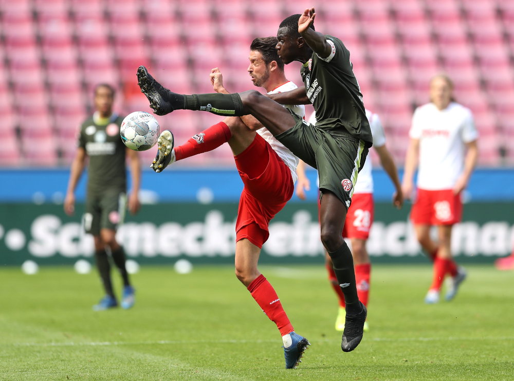 Cologneu00e2u20acu2122s German forward Mark Uth and Mainzu00e2u20acu2122 French defender Moussa Niakhate (right) vie for the ball during the German first division Bundesliga football match FC Cologne v Mainz 05 May 17, 2020 in Cologne. u00e2u20acu201d AFP pic