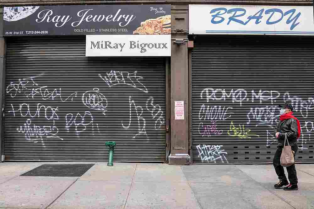 A man wearing a mask walks past shuttered businesses on Broadway as the spread of Covid-19 continues in New York April 25, 2020. u00e2u20acu201d Reuters pic