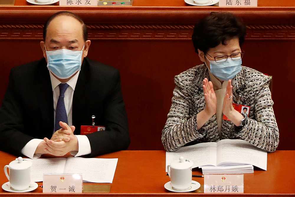 Hong Kong Chief Executive Carrie Lam (right) and Macau Chief Executive Ho Iat-seng wearing face masks at the opening session of China's National People's Congress in Beijing May 22, 2020. u00e2u20acu201d Reuters pic