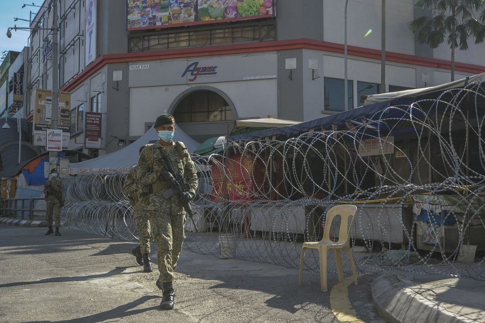 Armed Forces personnel patrol the vicinity of the Chow Kit wet market in Kuala Lumpur May 5, 2020 u00e2u20acu201d Picture by Shafwan Zaidon
