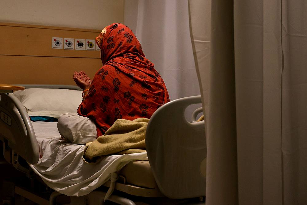 A patient suffering from Covid-19 prays at the emergency ward of Max Smart Super Speciality Hospital in New Delhi, India May 28, 2020. u00e2u20acu201d Reuters pic 