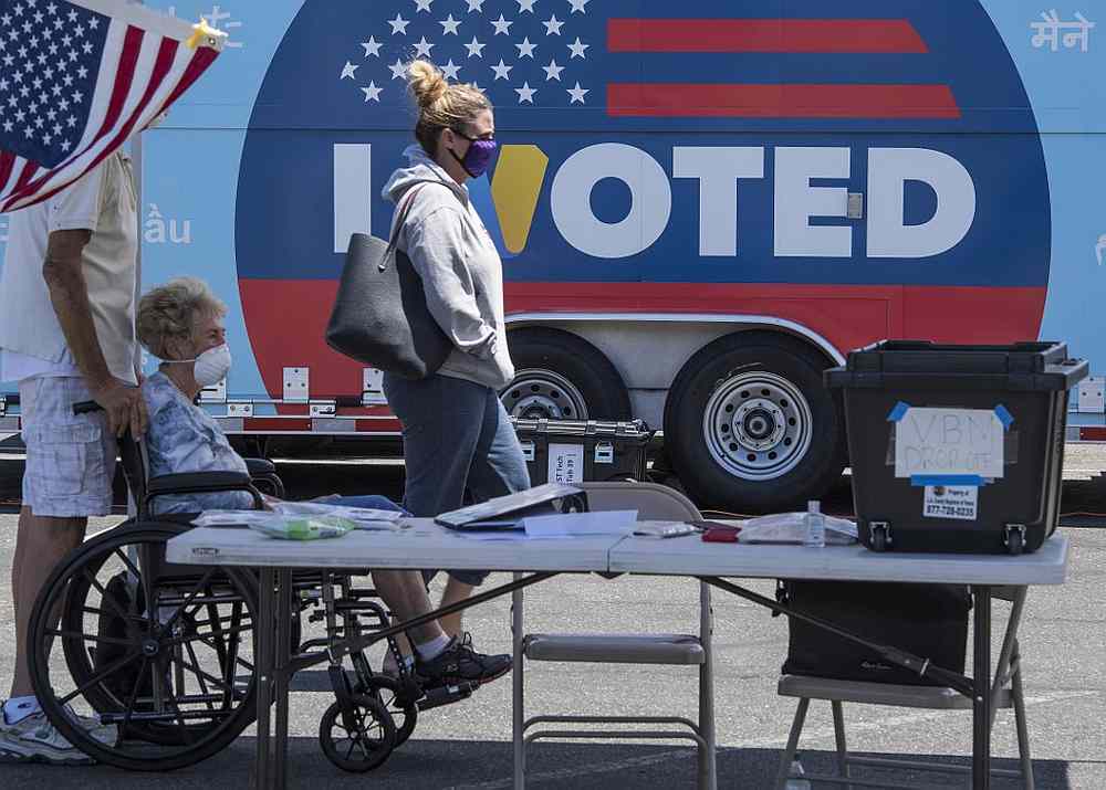 People wait to cast their votes at a polling station for the special election between Democrat Christy Smith and Republican Mike Garcia in Santa Clarita, California May 12, 2020. u00e2u20acu201d AFP pic