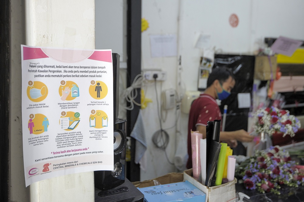 A notice detailing new standard operating procedures during the conditional movement control order is displayed at a florist in Kuala Lumpur May 4, 2020. ― Picture by Shafwan Zaidon