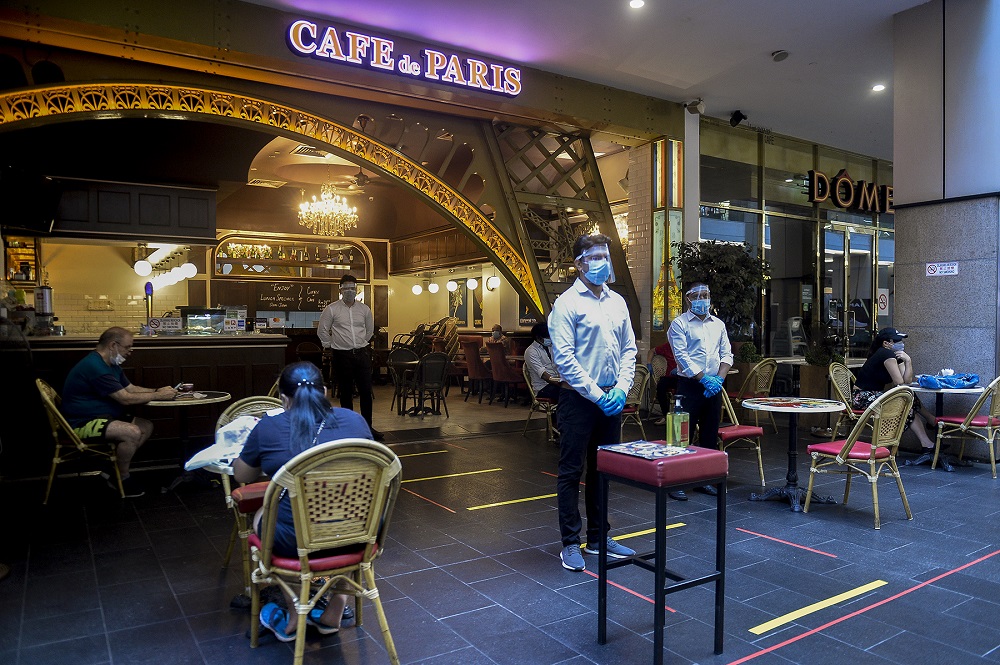 People are seen having breakfast at a restaurant in a shopping mall in Kuala Lumpur on the first day of the conditional movement control order May 4, 2020. u00e2u20acu2022 Picture by Miera Zulyana