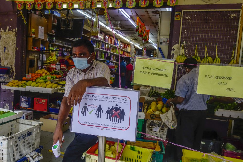 Notices detailing standard operating procedures during the conditional movement control order are displayed at the entrance of a sundry shop in Kuala Lumpur May 12, 2020.u00e2u20acu201d Picture by Shafwan Zaidon