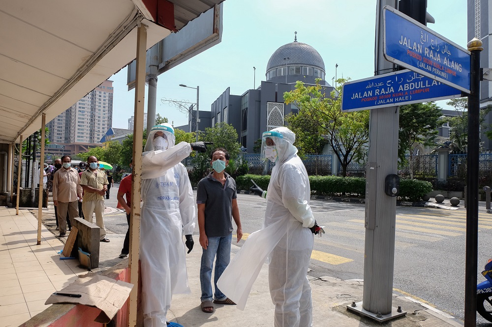 People are seen queuing up to be tested for Covid-19 at Kampung Baru in Kuala Lumpur May 8, 2020. u00e2u20acu2022 Picture by Yusof Mat Isa